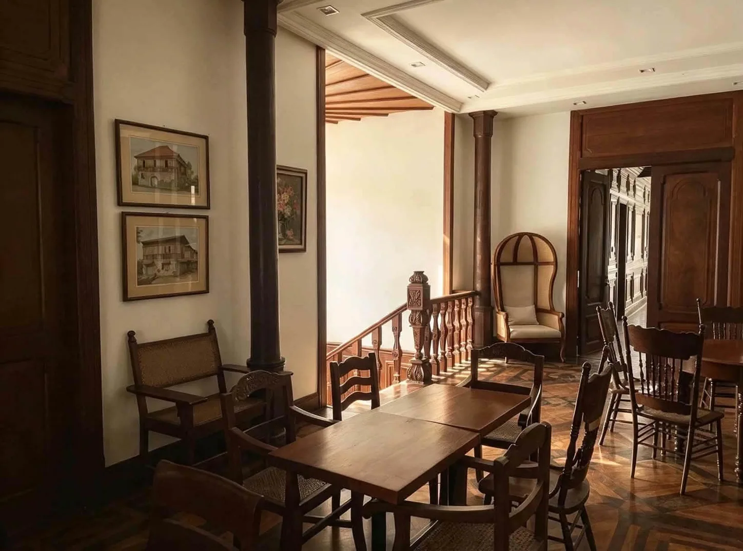Traditional wooden furniture and a stairwell inside Palacio Real
