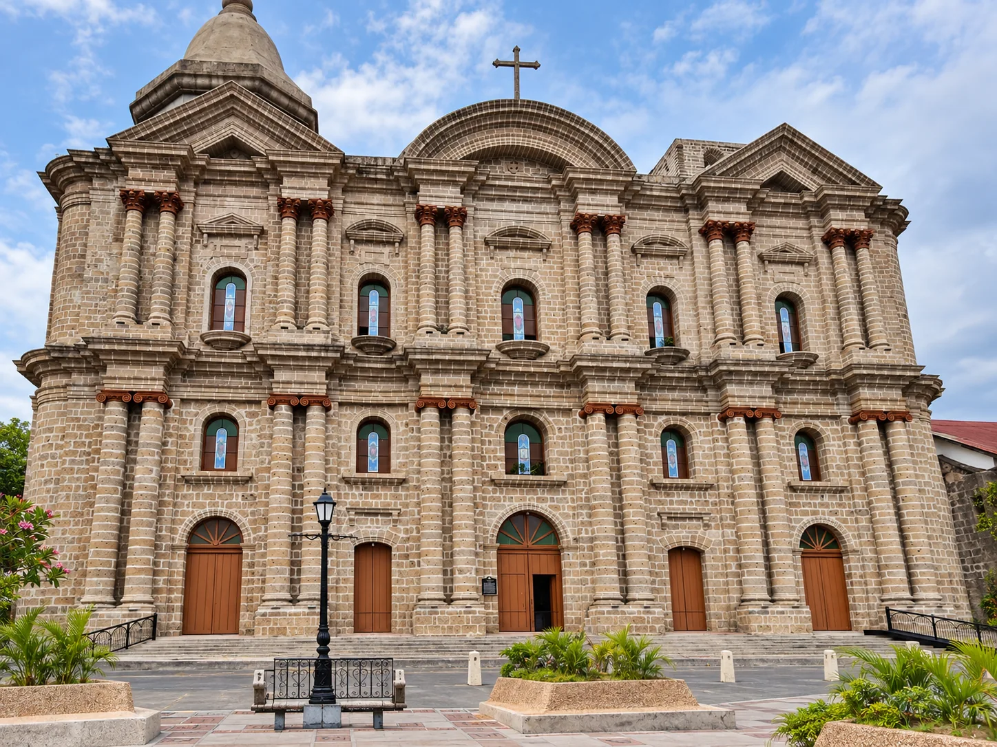 Stone facade and arched entrance of the Basilica of Saint Martin of Tours in Taal, Batangas