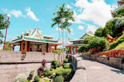 Cebu City Pagoda Near Tall Trees Under Blue Sky