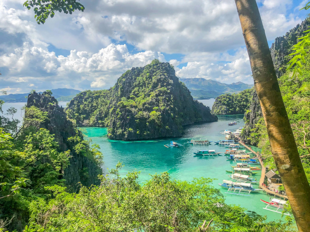 Coron Travel Guide: Wreck Dives, Kayangan Lake, and Island Bliss Coron travel guide cliffs and sea