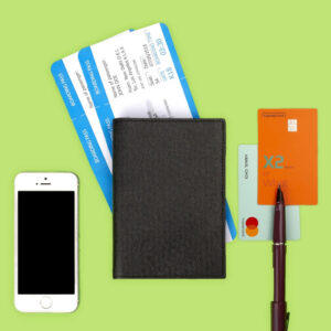 booking flights - cellphone boarding pass passport credit cards