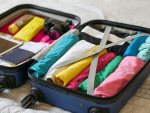 smart packing tips – open suitcase with organized compartments