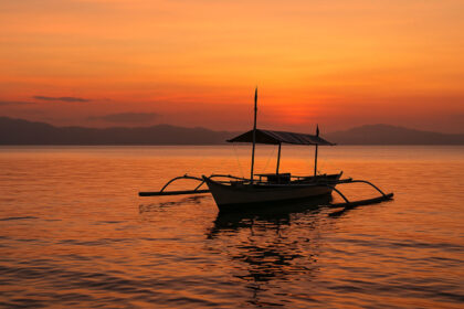 Sorsogon Travel Guide: Whale Sharks, Hot Springs, and Laid-Back Shores Donsol Bay sunset scene with banca for Sorsogon travel guide