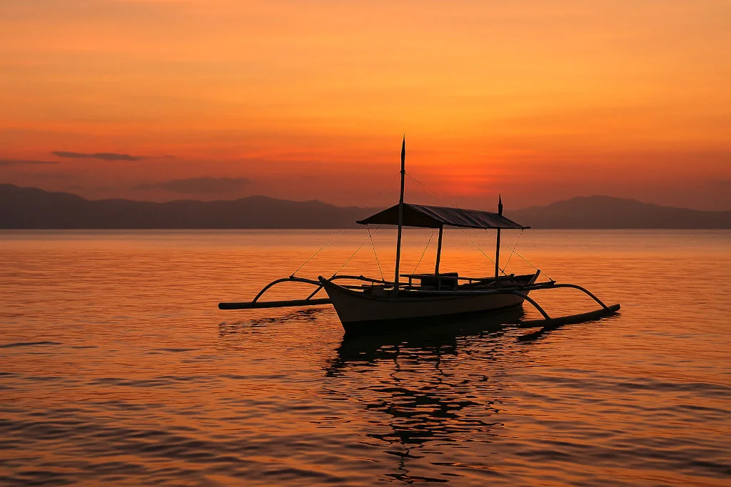 Donsol Bay sunset scene with banca for Sorsogon travel guide