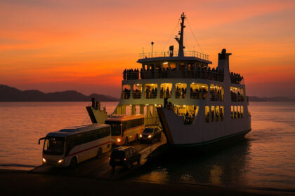 RoRo ferry boarding buses and cars at sunset in the Philippines