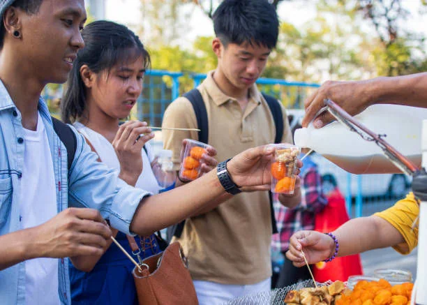 Students sharing merienda in a small town reflecting cultural immersion Philippines