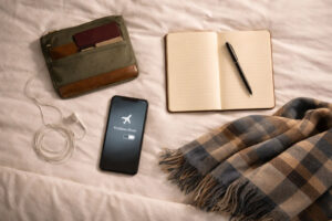 Bed flatlay of essentials for evening travel calming rituals