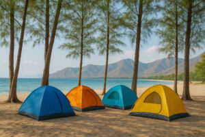 Beach campsite with tents under trees during camping in the Philippines