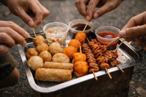 bakasyon captions Tagalog food trip vibe photo of a shared street food bite