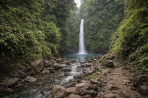 Baler Travel Guide view of Ditumabo Mother Falls in Aurora with rocky trail and swimming area