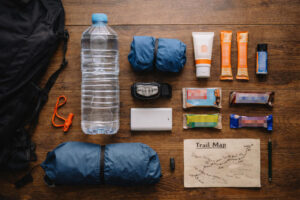 Daypack essentials checklist for beginner hikes Philippines including water, rain layer, snacks, and safety items