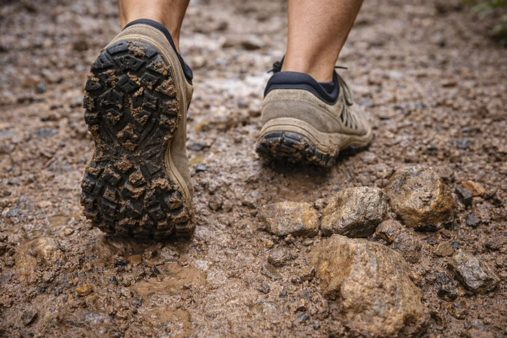 Grippy trail shoes for beginner hikes Philippines showing traction on mud and rock