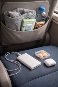 Alt Text: Cagayan de Oro To Banaue overnight bus comfort essentials like jacket, water, and power bank