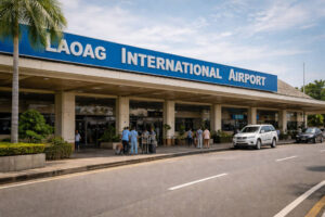 how to get to Calle Crisologo by flying to Laoag International Airport then transferring