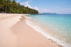Subic Beach Matnog shoreline showing sand color and calm-day water for Best Beaches In Sorsogon