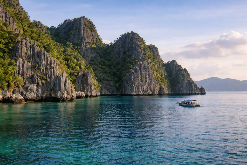 things to do in Coron with calm blue water and limestone cliffs in Coron