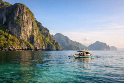 El Nido Tours A B C D: What Each Route Usually Focuses On El Nido Tours A B C D boat view in Bacuit Bay with limestone cliffs