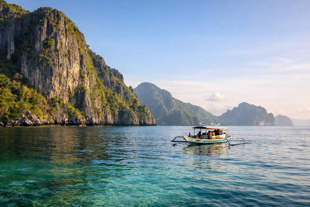 El Nido Tours A B C D boat view in Bacuit Bay with limestone cliffs