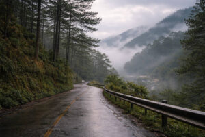 Foggy mountain road conditions affecting how to get around Sagada during wet or misty weather