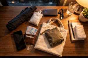 Ilocos Norte Nightlife essentials including rain gear, power bank, and cash for a calm night out