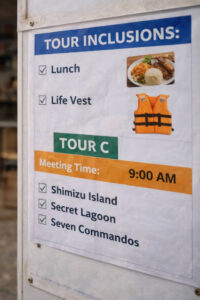 Close-up of an El Nido island hopping tour inclusions board, scams in El Nido prevention tip