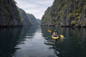 Kayaking in Twin Lagoon Coron with limestone walls