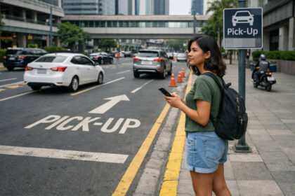 How to Use Grab in the Philippines: Traveler waiting at a marked pickup area while using Grab in the Philippines