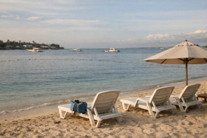 Calm shoreline scene for best beaches in Mactan with loungers and open water