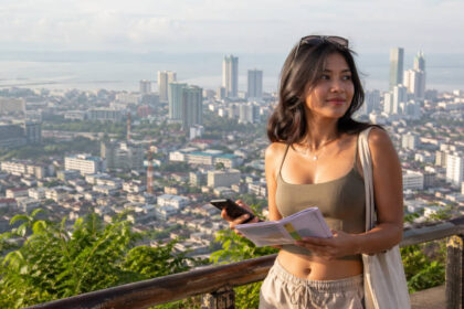 Mika planning a calm first visit with Cebu City travel tips and the Cebu City skyline behind her