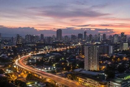 Solo travel Cebu City skyline at dusk with calm evening lights and visible roads