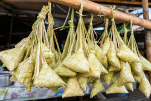 Hanging puso rice bundles at a Cebu food stall