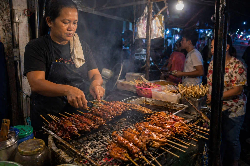 Cebu street barbecue skewers over charcoal