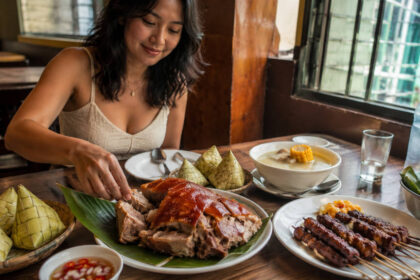 best restaurants in Cebu City table with lechon, puso rice, grilled food, and vinegar dip