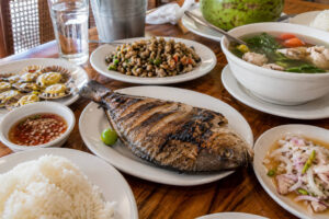 best restaurants in Cebu City seafood meal with grilled fish and hot soup for travelers