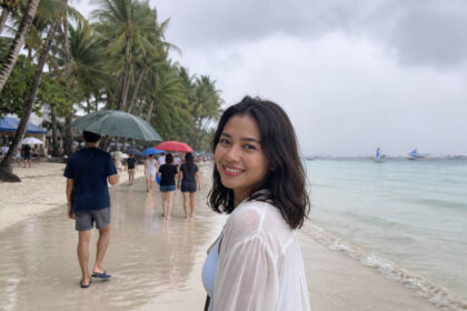 Boracay rainy day beach with gray clouds and wet sand