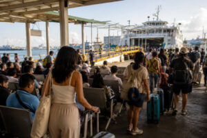 Passengers waiting with bags before a Cebu City to Siquijor ferry