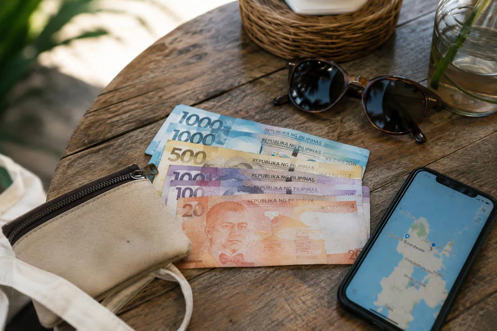 Small peso bills prepared for the cloud 9 siargao entrance fee and visit budget