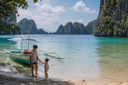 Coron with Kids family-friendly shoreline with calm water and limestone cliffs.