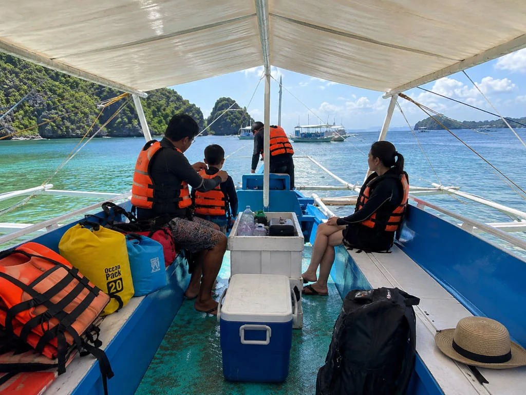 Coron with Kids boat with life jackets ready for family island hopping.