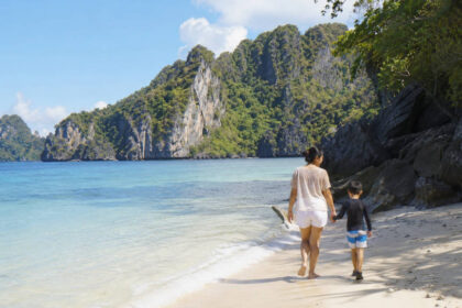 El Nido with kids on a calm family-friendly beach with shallow water and limestone cliffs