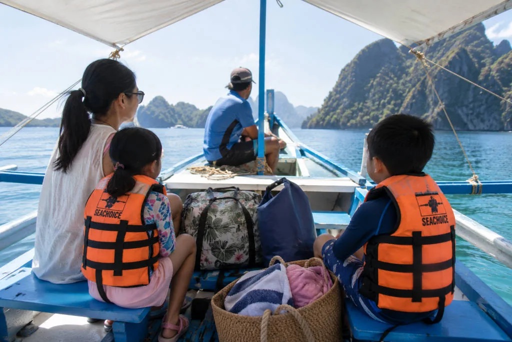El Nido with kids island hopping boat setup with life jackets for families