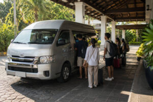 Van transfer option for how to get around Puerto Princesa on day trips