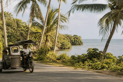 How to Get Around Siquijor: Tricycles, Vans, and Local Transport Local transport on a coastal road for how to get around Siquijor