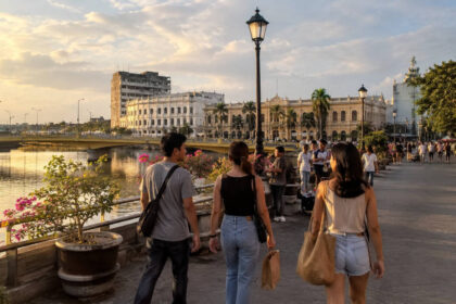 Travelers walking along Iloilo River Esplanade for Iloilo City travel tips