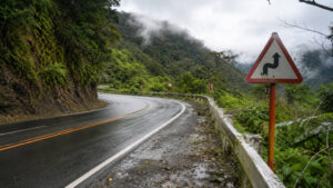 Curved mountain road conditions on the Manila to Baler motorcycle route