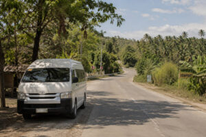 Countryside road showing transport planning for Chocolate Hills entrance fee costs