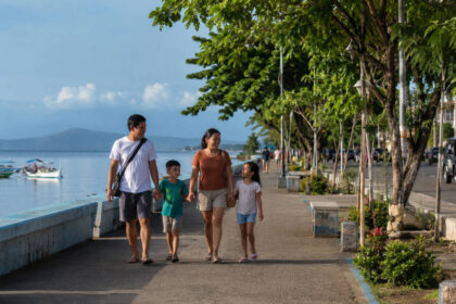Family walking in Puerto Princesa with kids on a calm travel day