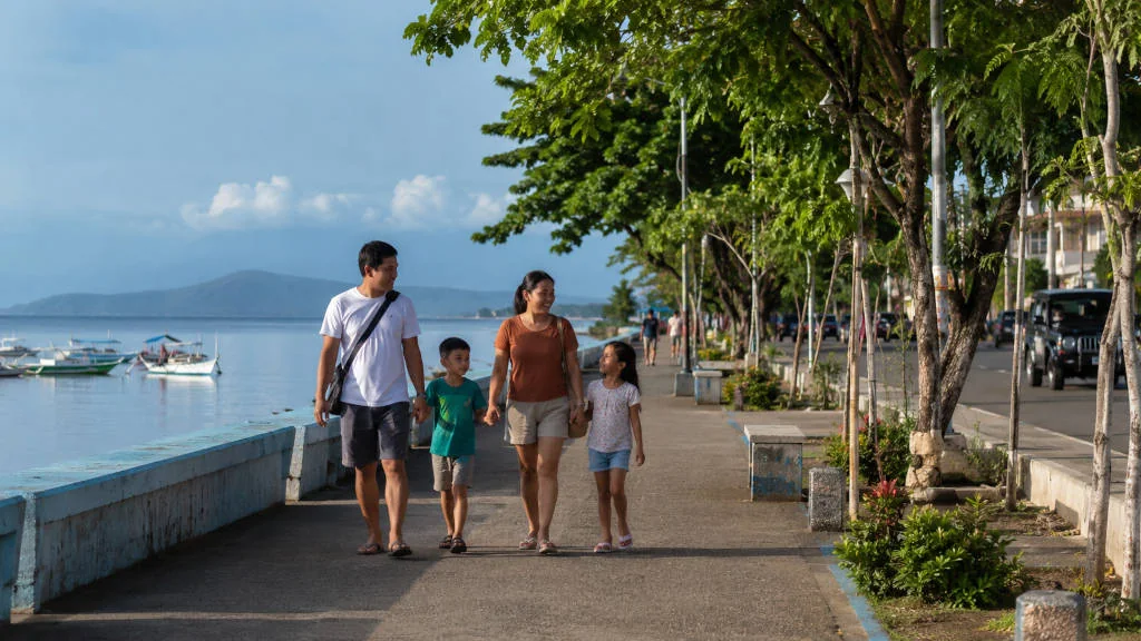 Family walking in Puerto Princesa with kids on a calm travel day