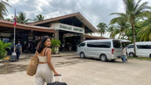 Shared vans waiting near Siargao Airport for a siargao airport to general luna transfer