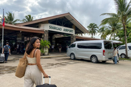 Shared vans waiting near Siargao Airport for a siargao airport to general luna transfer